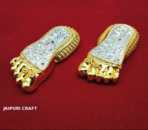 A pair of gold and silver foot-shaped jewelry pieces displayed on a textured red background, with the Jaipuri Craft brand logo visible in the top right and bottom left.